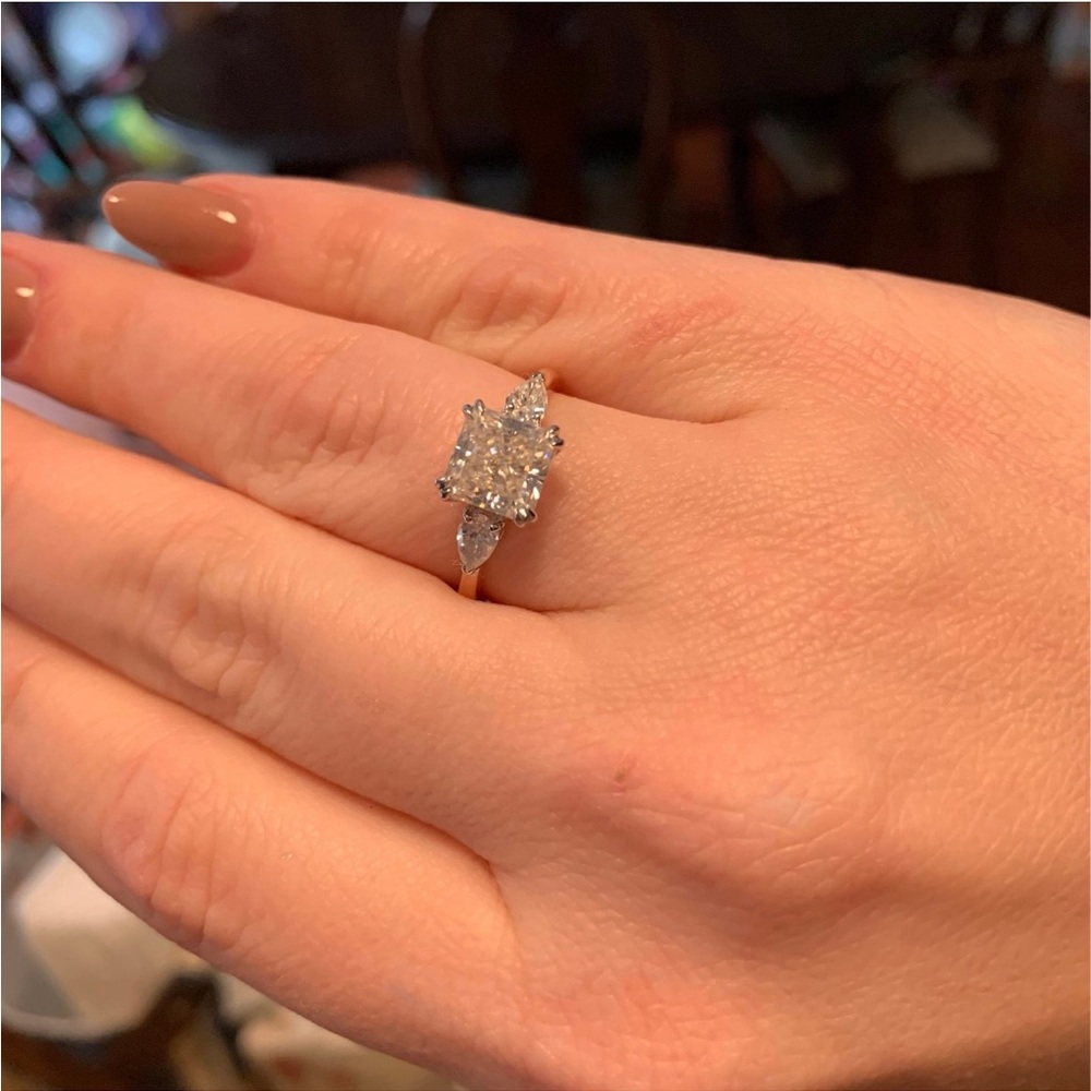 Three stone 14k rose gold moissanite ring